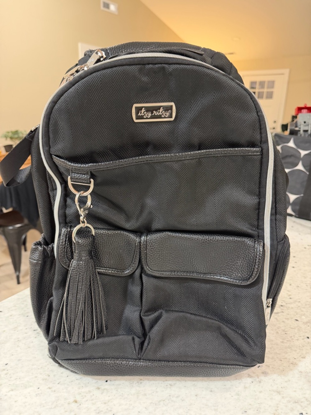 Itzy Ritzy Black Diaper Backpack with Tassel Charm